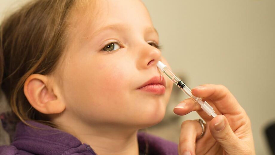 Photo-of-child-being-administered-influenza-vaccine-live-attenuated-nasal-2-1